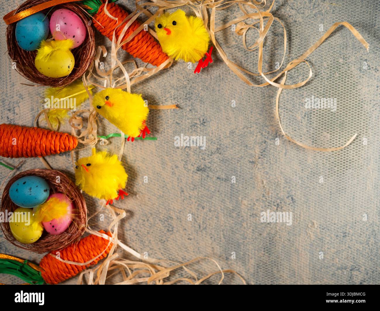 Easter display with eggs chicks and carrots with straw  Stock Photo