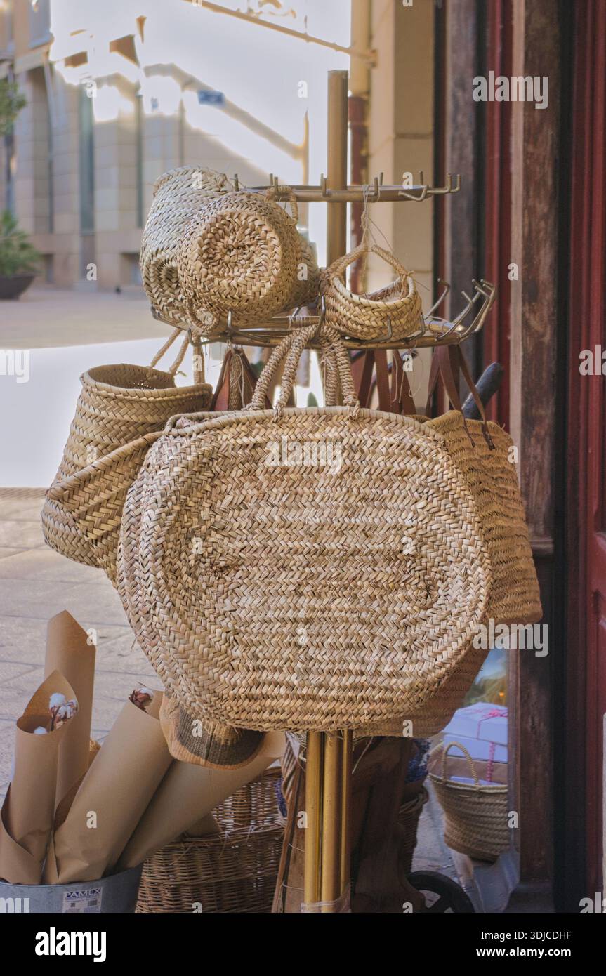 Handmade wicker baskets on a city street. Stock Photo