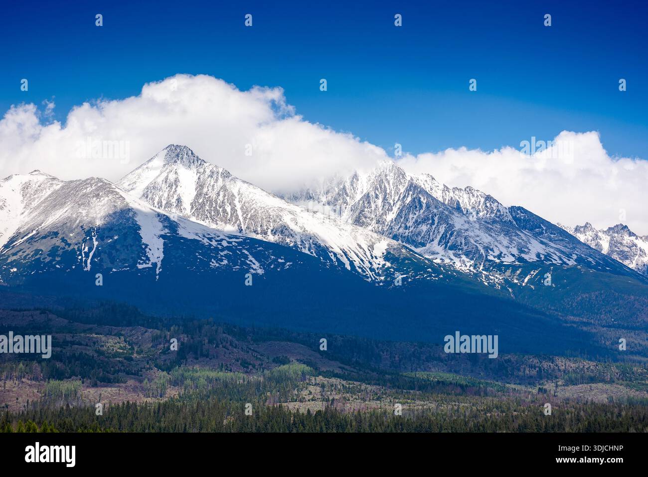 snow capped mountain peaks of high tatras in spring. scenic view of popular travel destination for remote trekking in slovakia, europe. alpine landsca Stock Photo