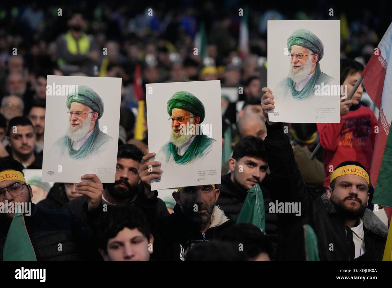 Khamenei Supporters Hezbollah supporters hold up portraits of the Iranian Supreme Leader ...