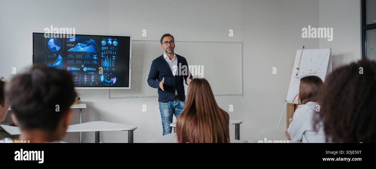 Science teacher teaching in high school classroom Stock Photo - Alamy