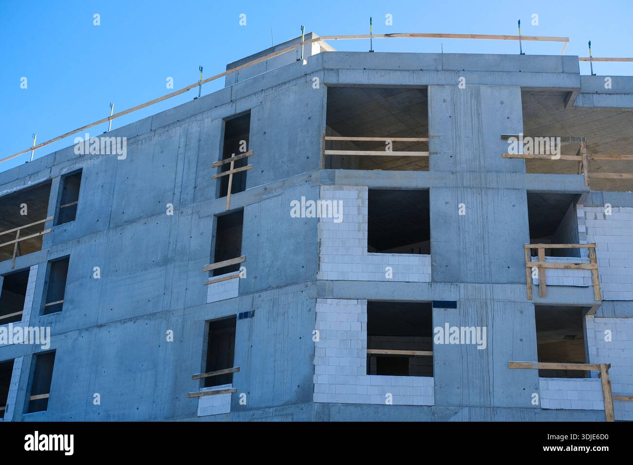Humoring Block Work Low-angle exterior of grey concrete structure with blockwork infill ...