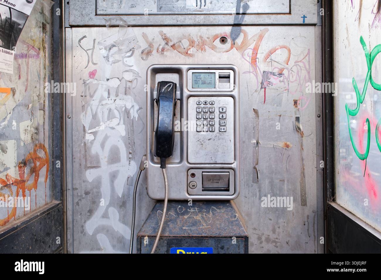 Old style coin operated telephone in booth in city street Stock Photo ...