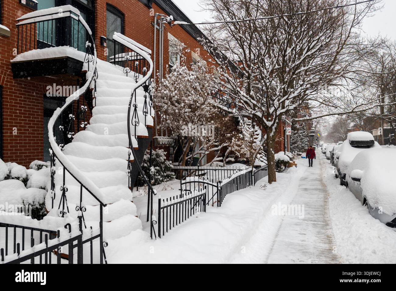 Montreal, CA - 26 January 2026: Set of traditional Montreal outdoor stairs heavily covered in snow during winter storm - Smartphone Captured Stock Image