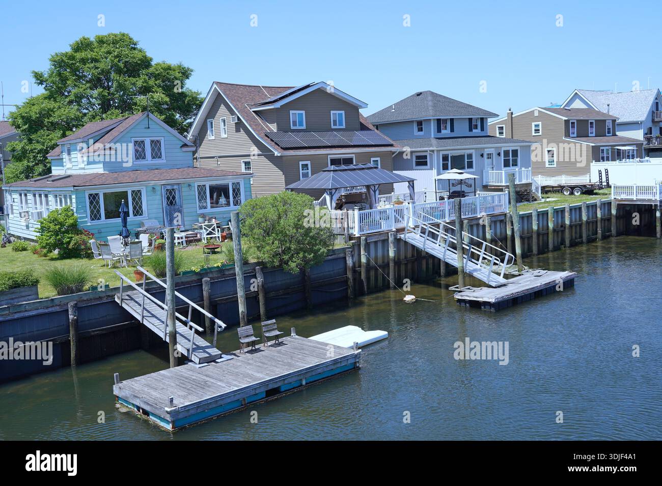 waterfront homes with boat docks provide easy access to water recreation Stock Photo