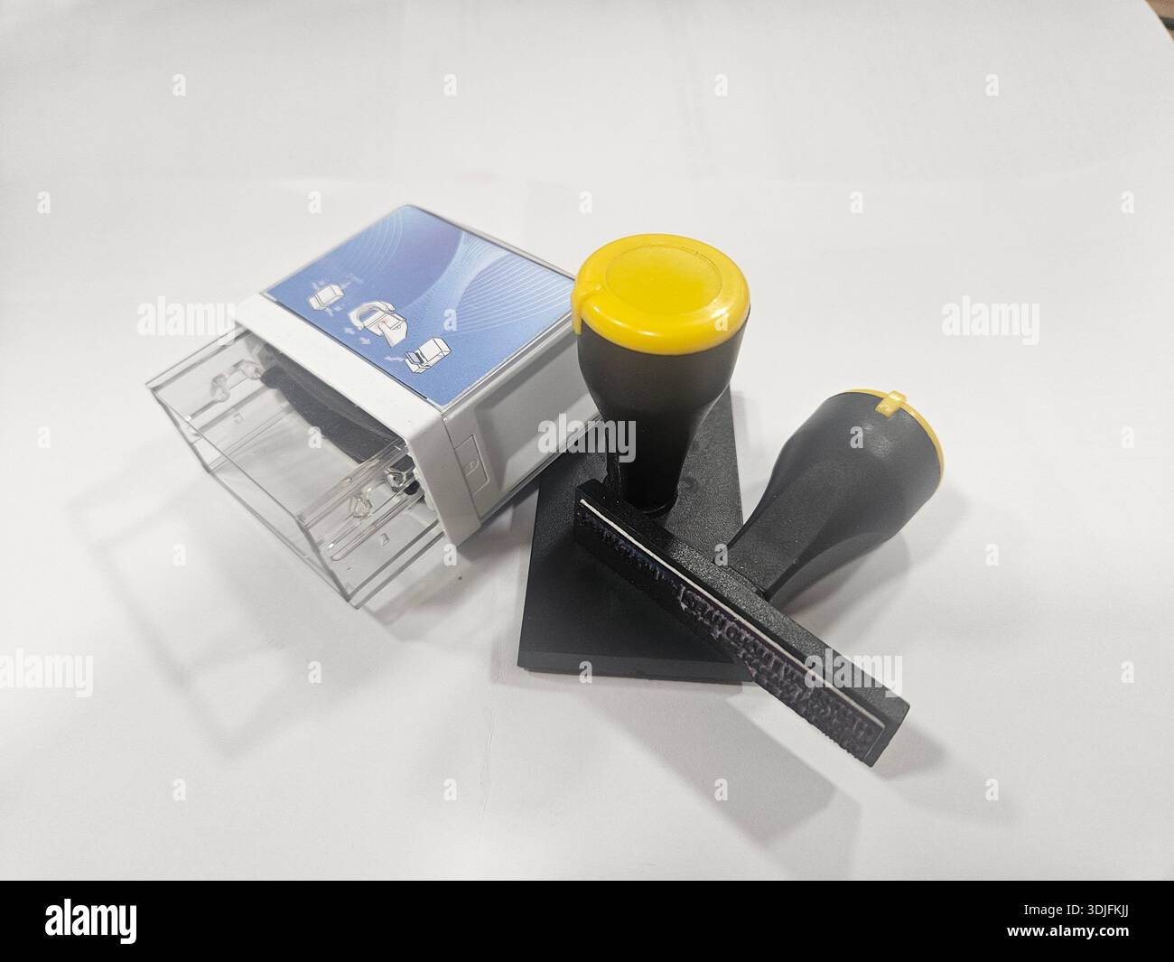 Essential Office Fasteners on White Surface. - Smartphone Captured Stock Image