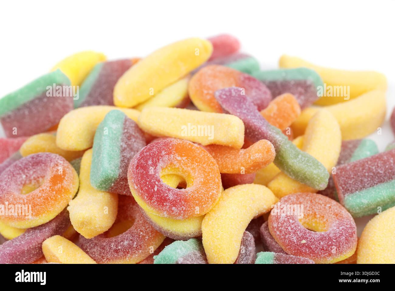 assorted jelly candies floating on white background. Stock Photo