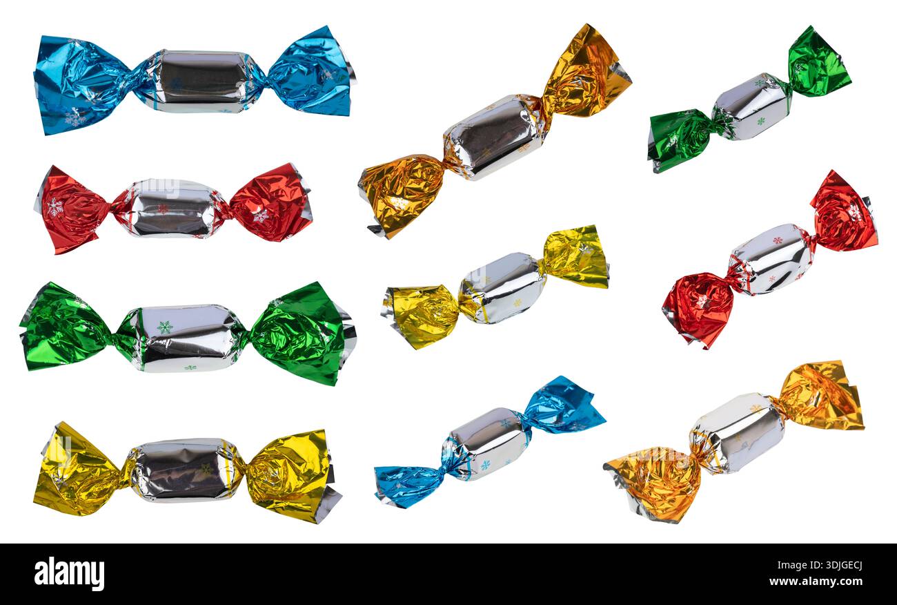 Candies in bright wrappers falling on white background, Stock Photo