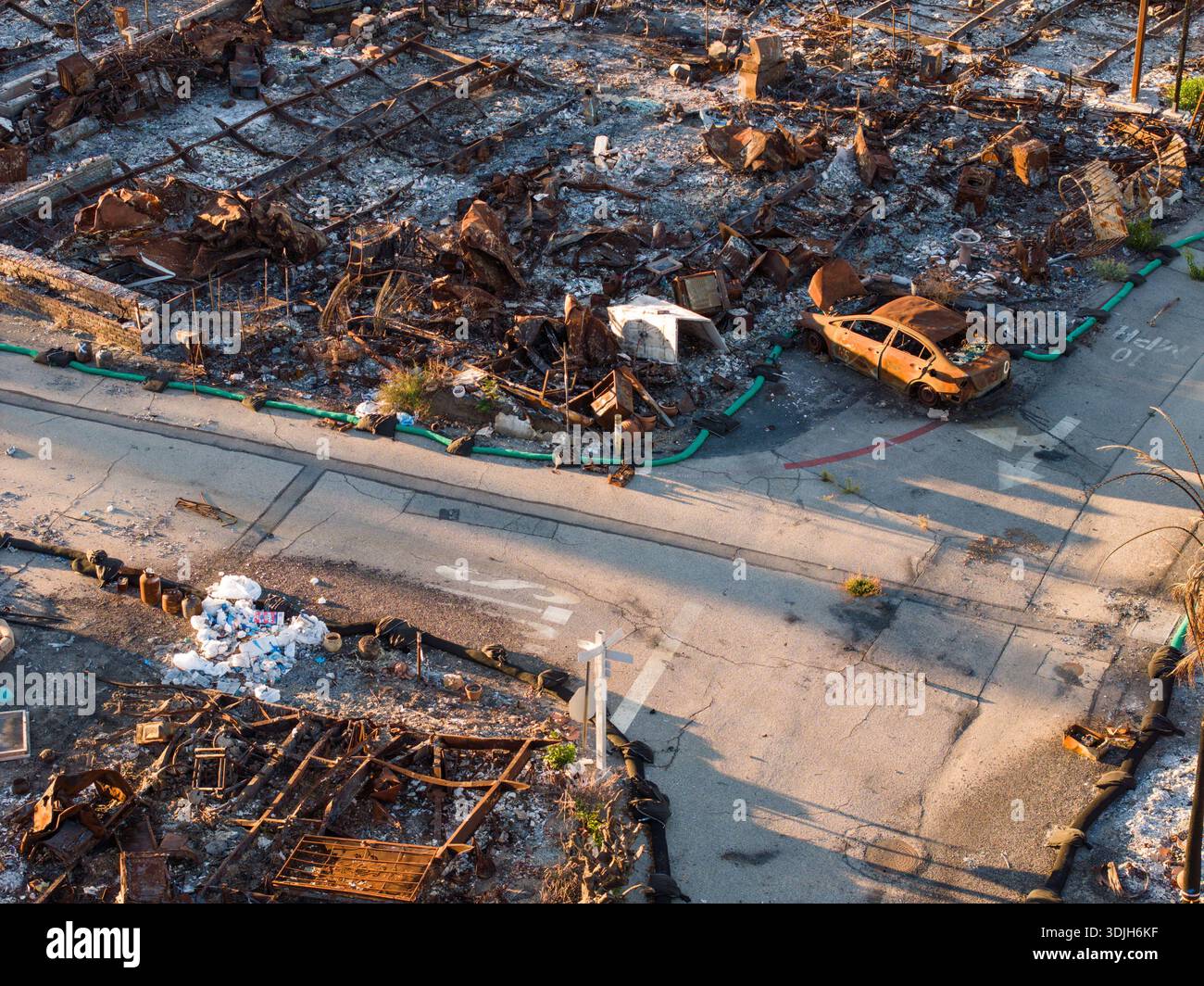 Aerial view of the aftermath of a fire leaving behind charred remains ...