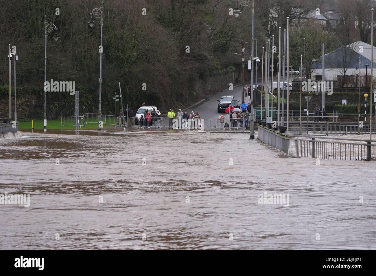 People watching the banks of the River Slaney flood in Enniscorthy, Co ...