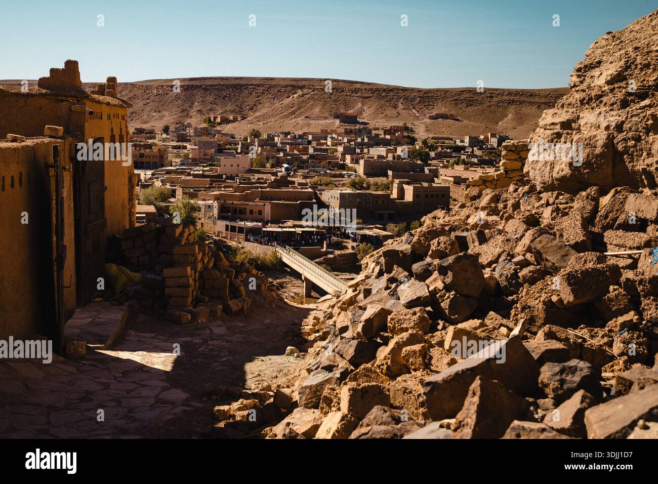 Traditional desert village built of adobe and stone, hillside ...