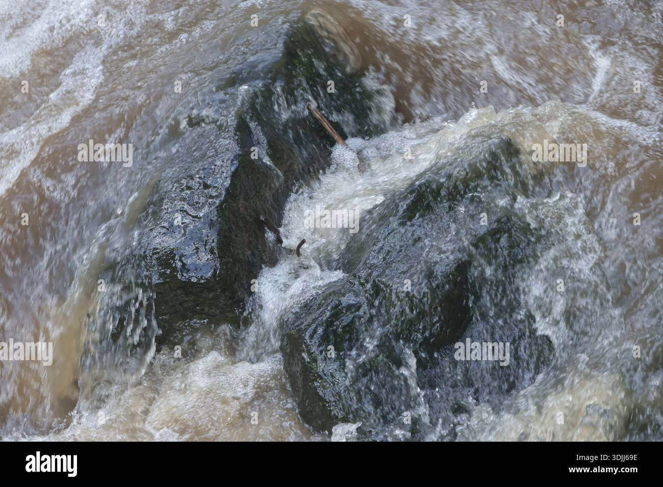 Flood Including Rocks Dublin, Ireland - 27th January 2026: Fast flowing water over rocks in a ...