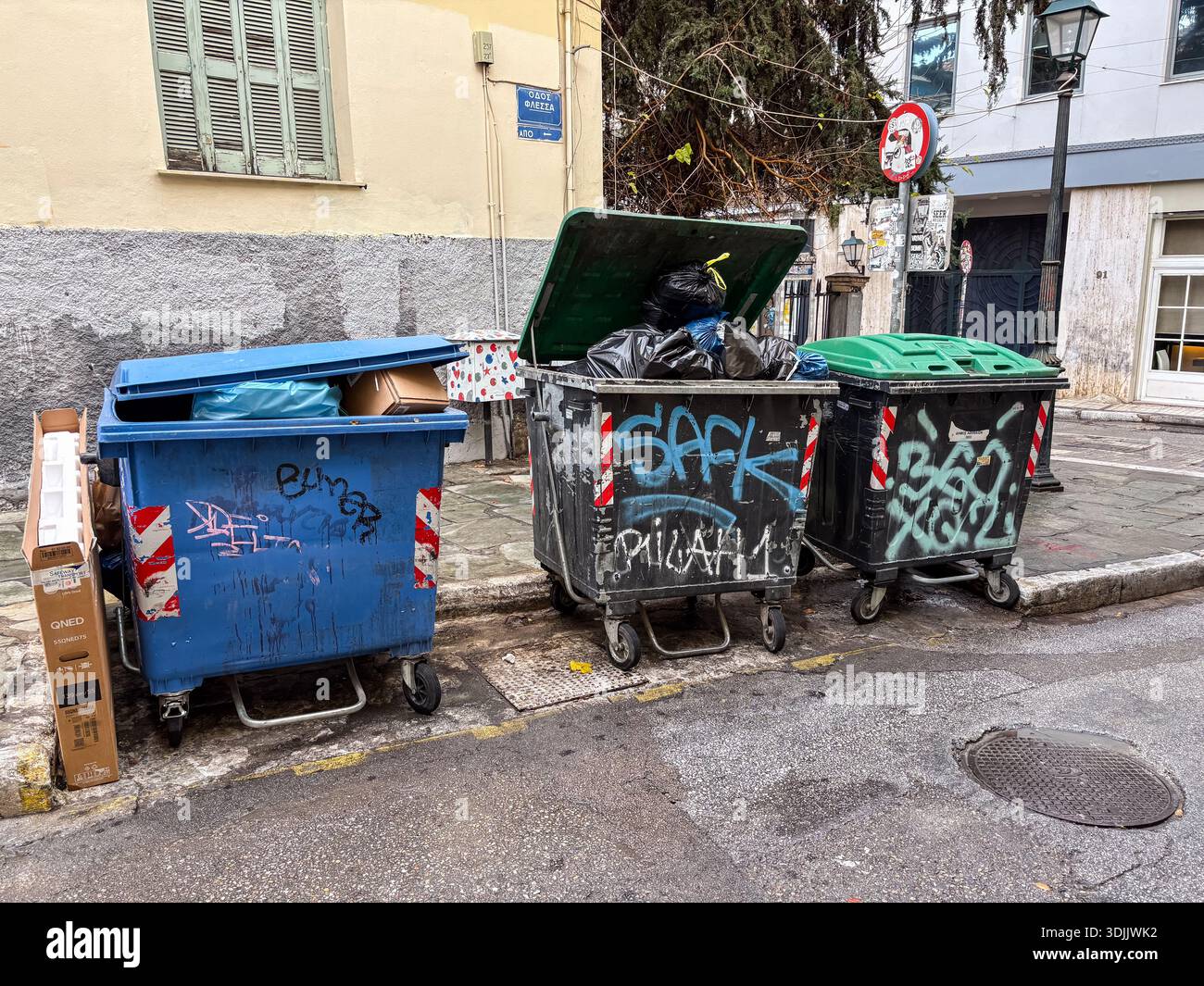 Overflowing Rag Container Overflowing garbage container graffiti hi-res stock photography and ...
