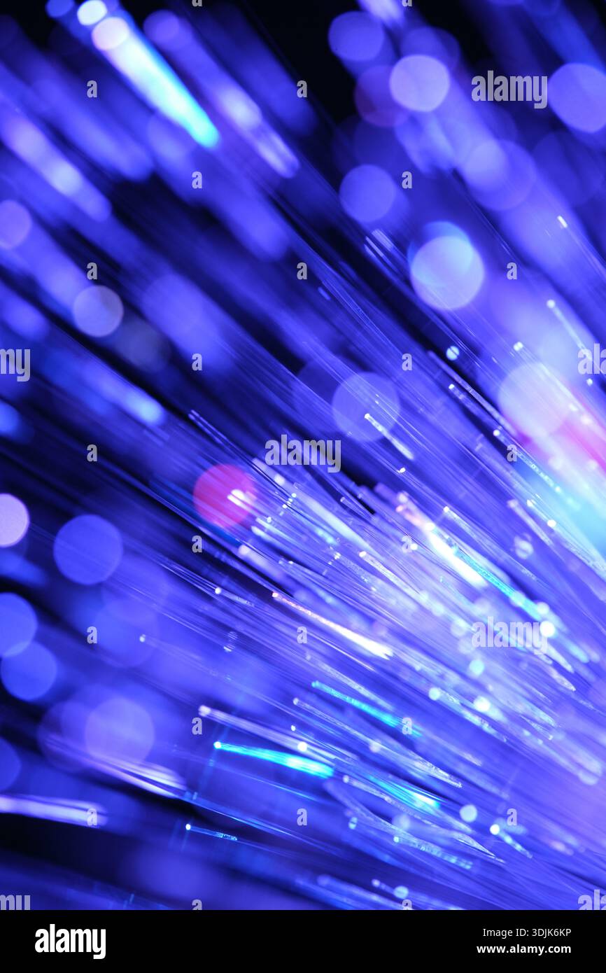 Optical fibres dinamic flying from deep on technology abstract background. Stock Photo