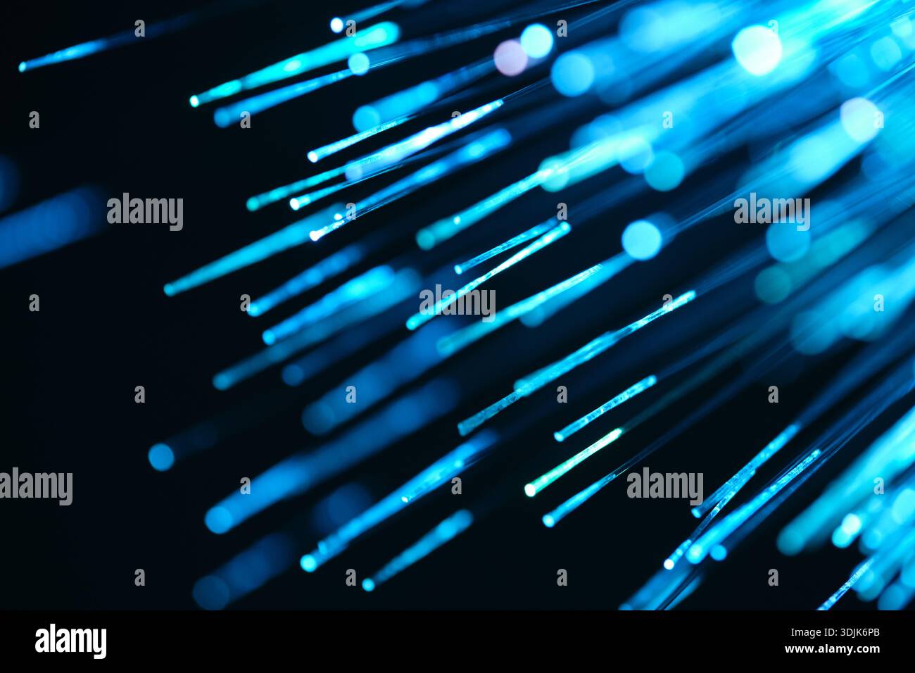Fiber optical network cable in blue light. Close up macro Stock Photo