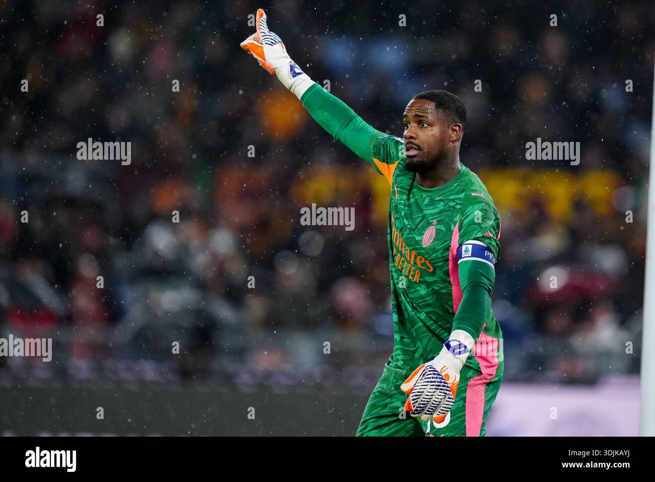 Mike Maignan of AC Milan gestures during the Serie A Enilive match ...