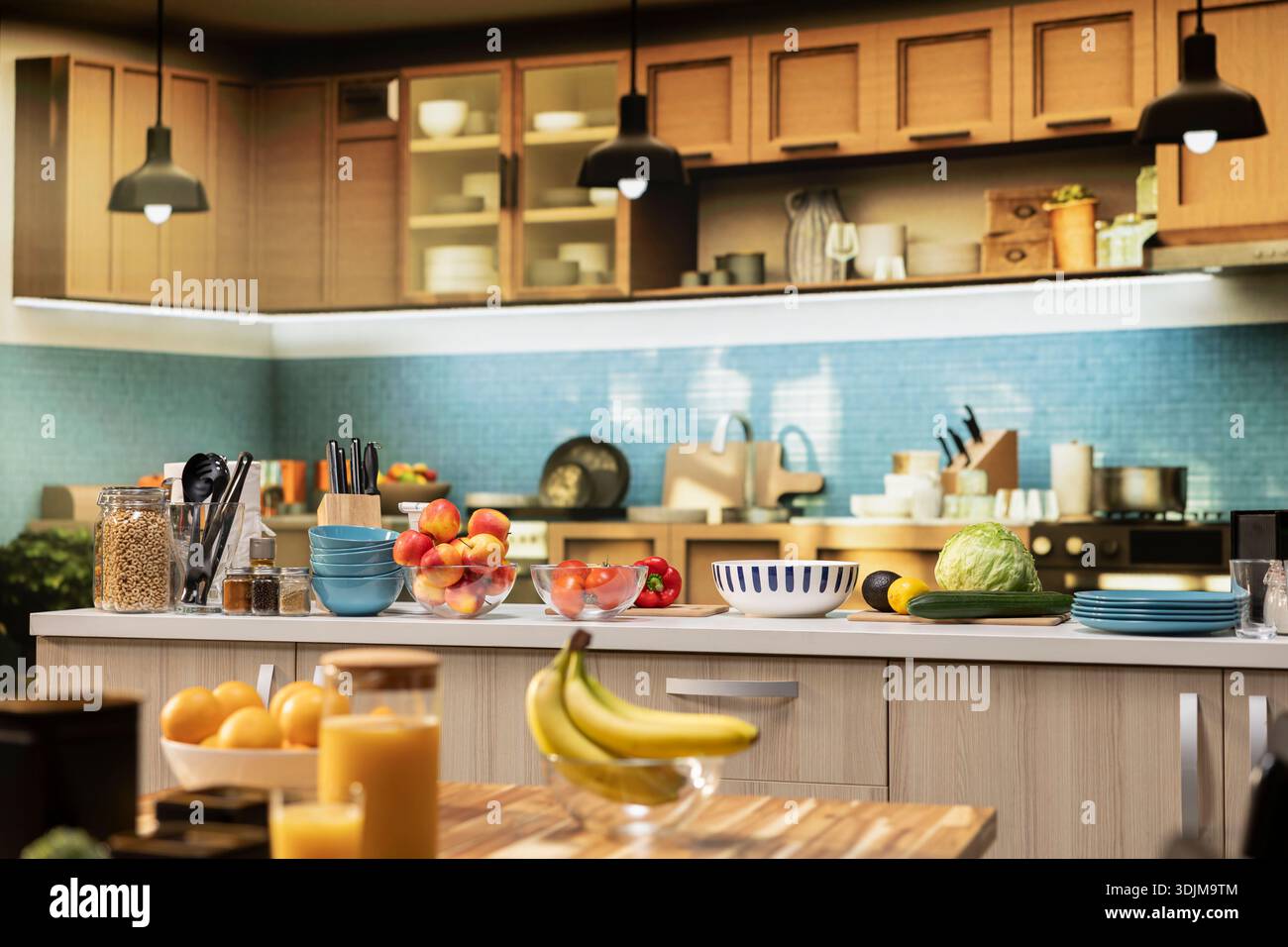 Empty modern kitchen interior in a contemporary apartment. Bright space includes a clean table, stylish kitchenware, fresh fruits and condiments on the counter. Healthy cooking in cozy home. Stock Photo