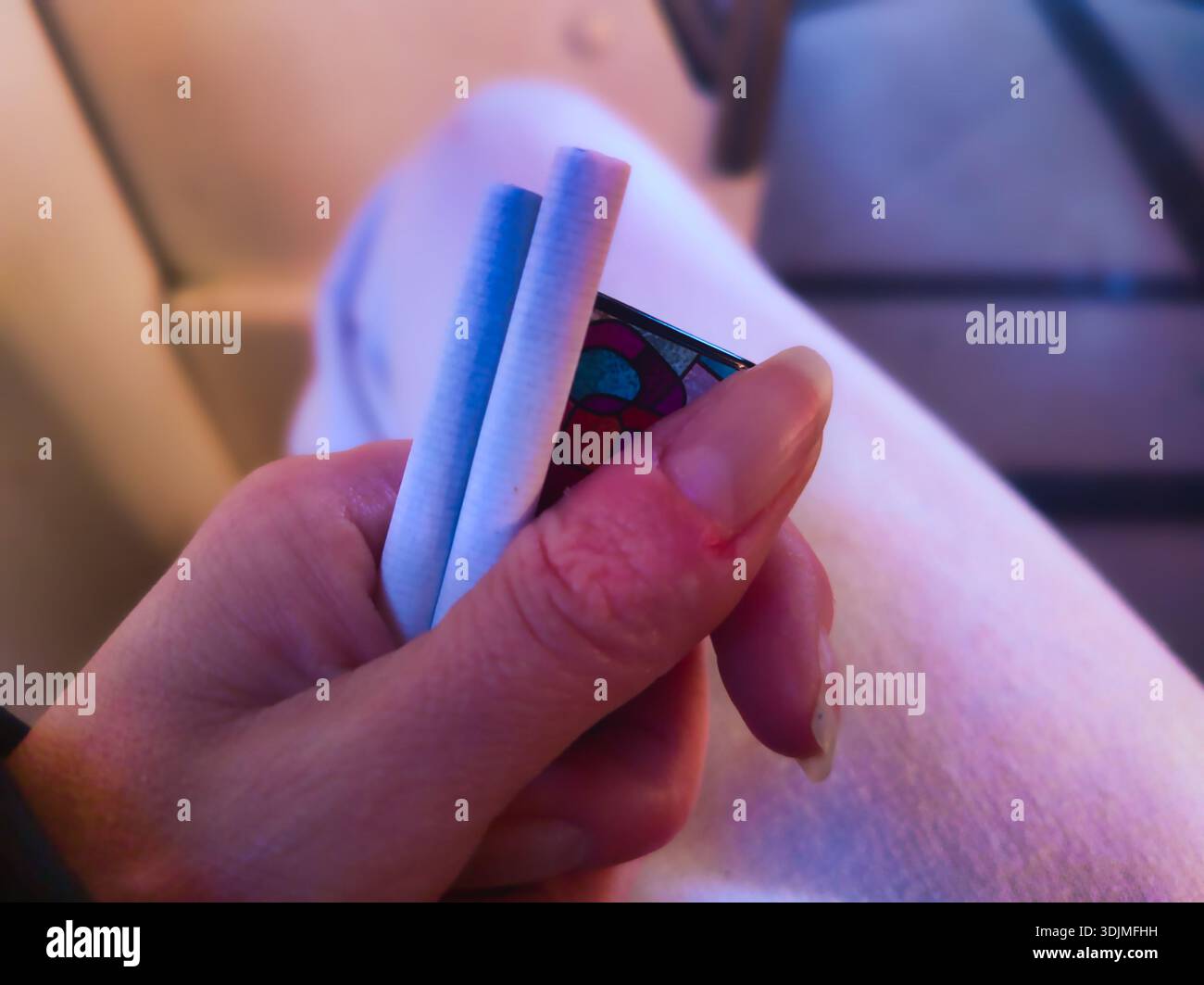Lighting two cigarettes hi-res stock photography and images