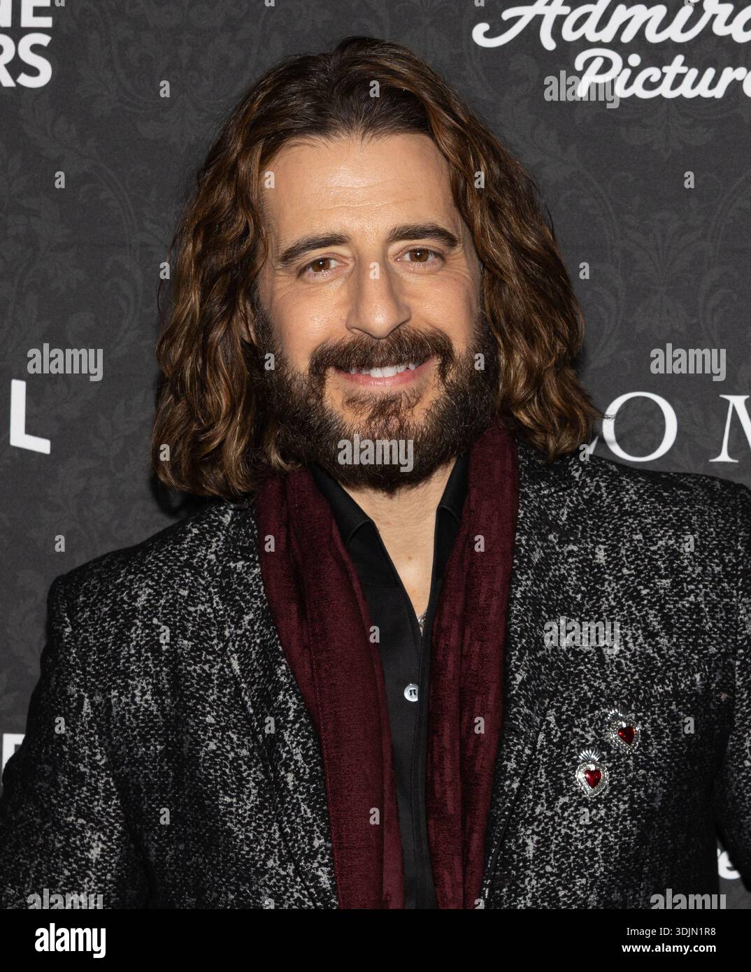 Jonathan Roumie Smiling Jonathan Roumie attends the premiere of