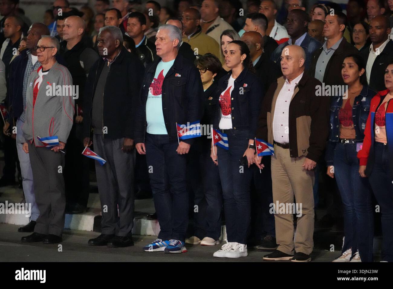 Cuba's President Miguel Diaz Canel, center, listens to the national ...