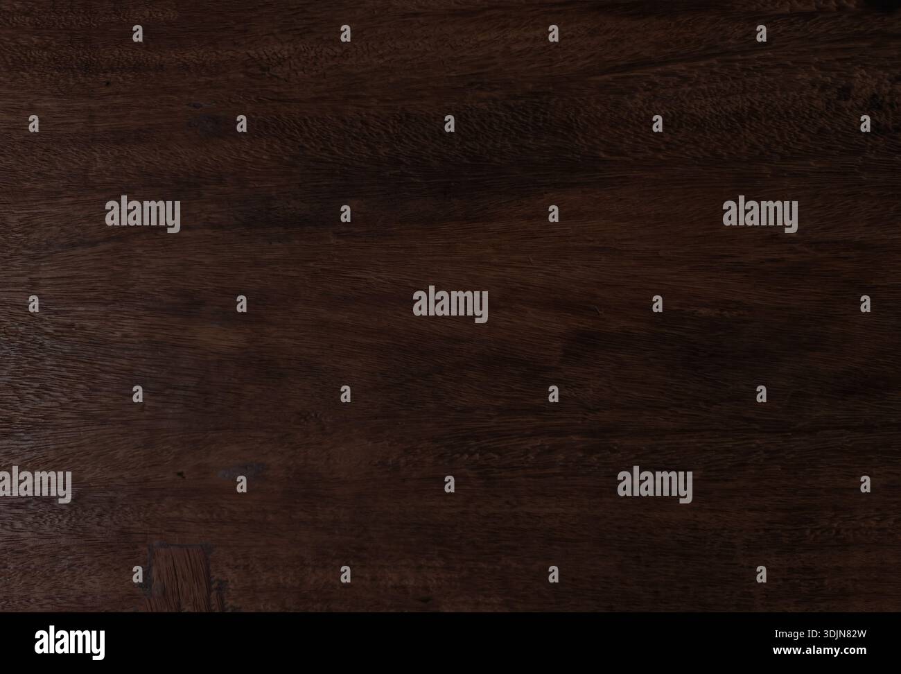 Rich dark brown wood grain texture from large natural tree trunk. High-resolution timber surface features organic patterns perfect for rustic backgrou Stock Photo