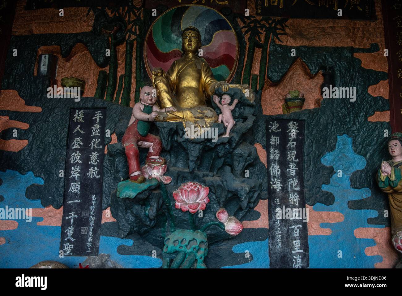 A colorful carving and mural depicting a buddhist scene, carved into ...
