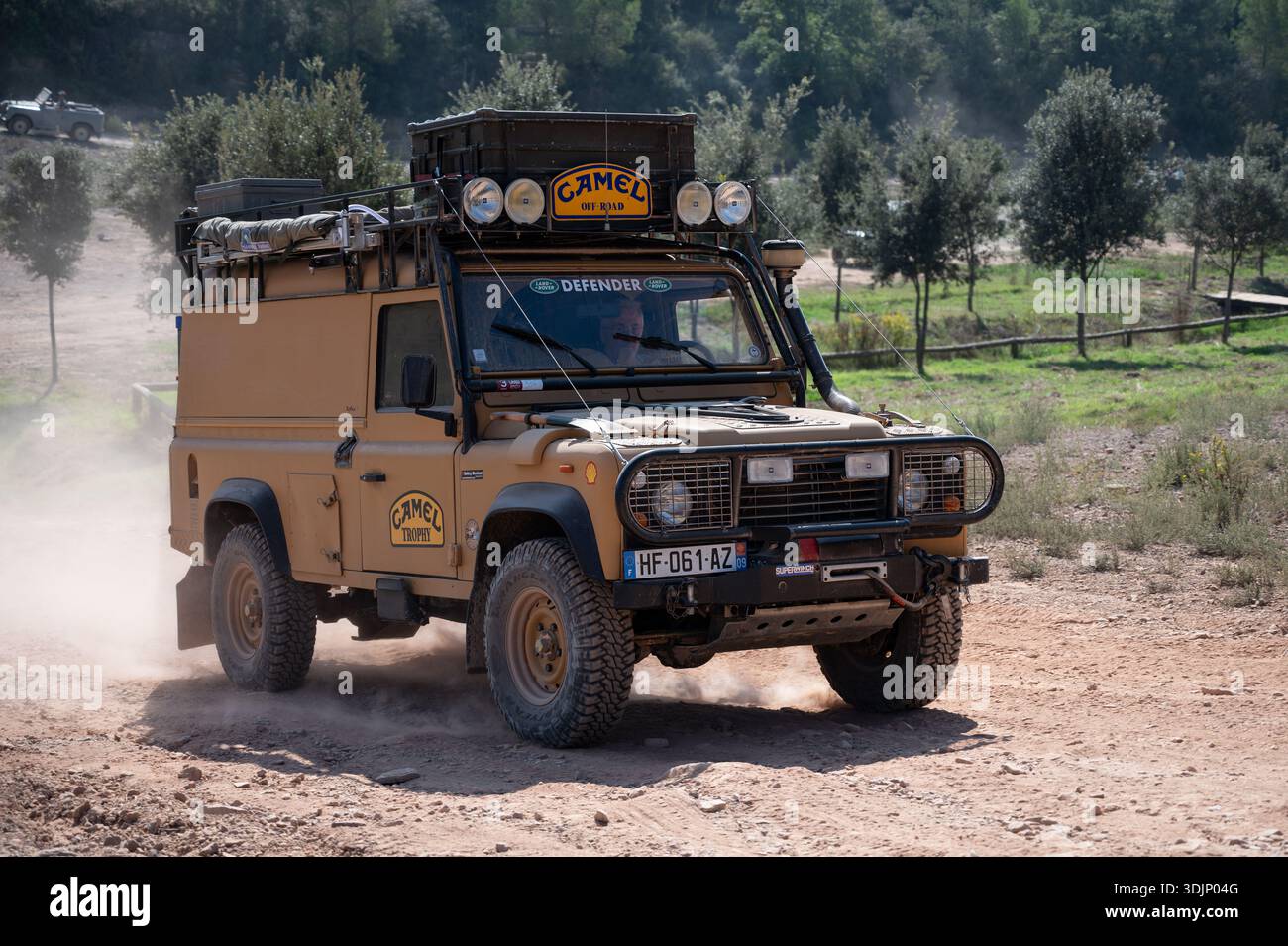 Front view of a classic, fully equipped yellow Land Rover Defender ...