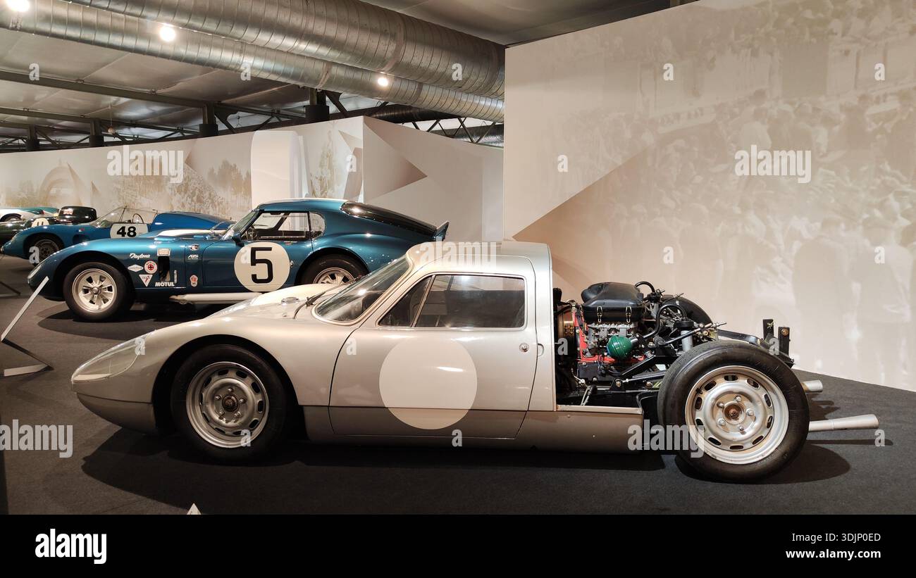 Side view of a historic silver Porsche 904 GTS racing car with the
