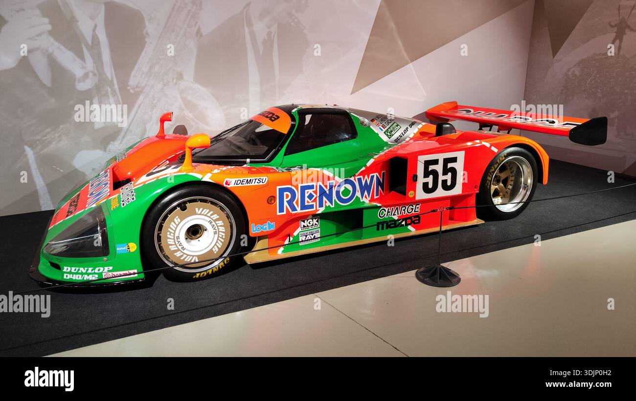Side detail of a historic green and orange Renown Mazda 787B racing car ...