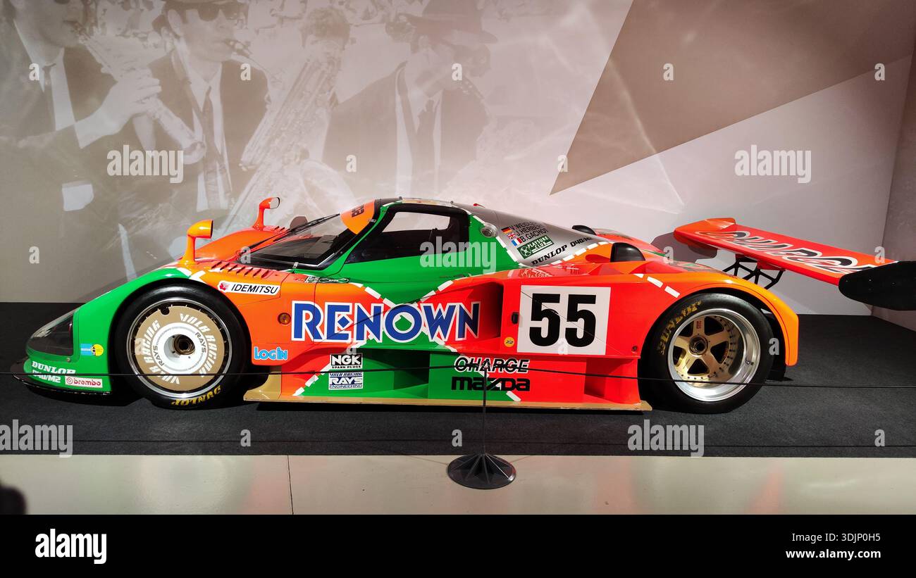 Side detail of a historic green and orange Renown Mazda 787B