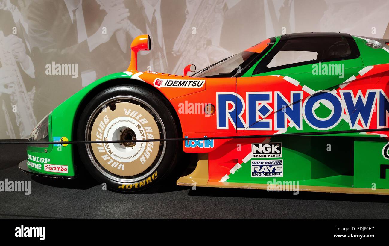 Side detail of a historic green and orange Renown Mazda 787B racing car ...