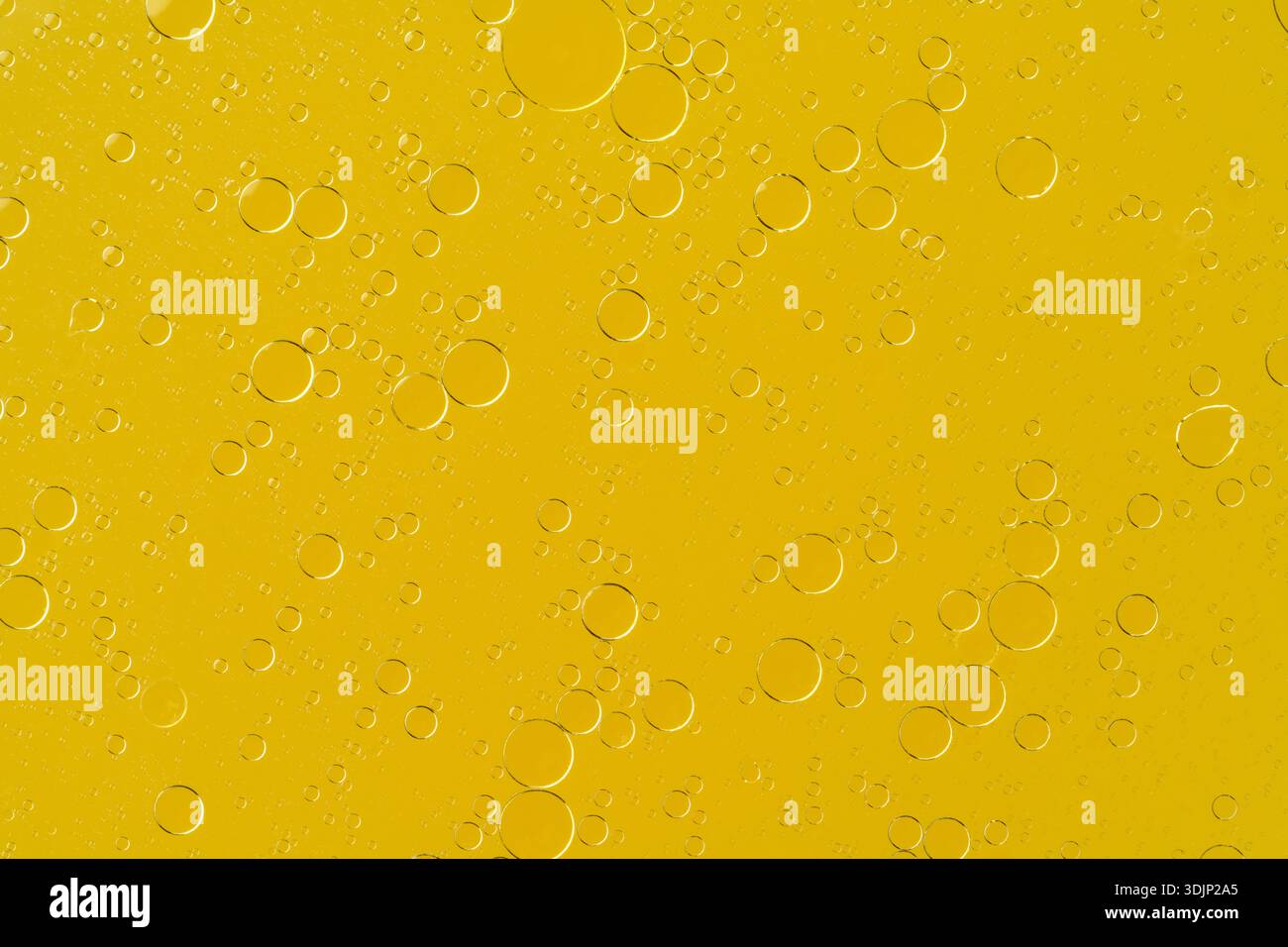 Golden liquid with bubbles abstract macro background Stock Photo