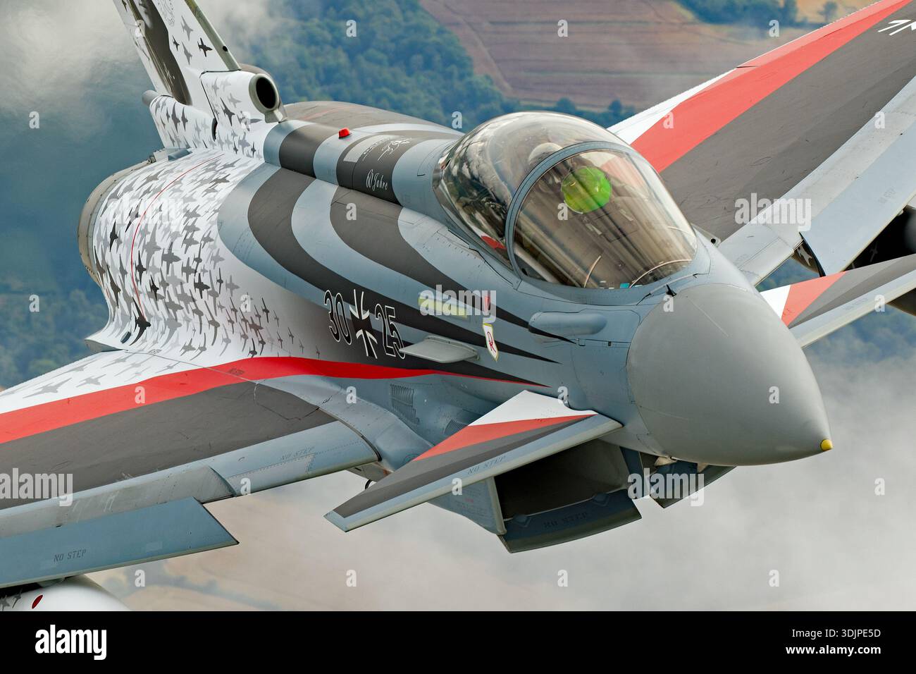 The image captures a Luftwaffe Eurofighter EF-2000 Typhoon S in flight ...