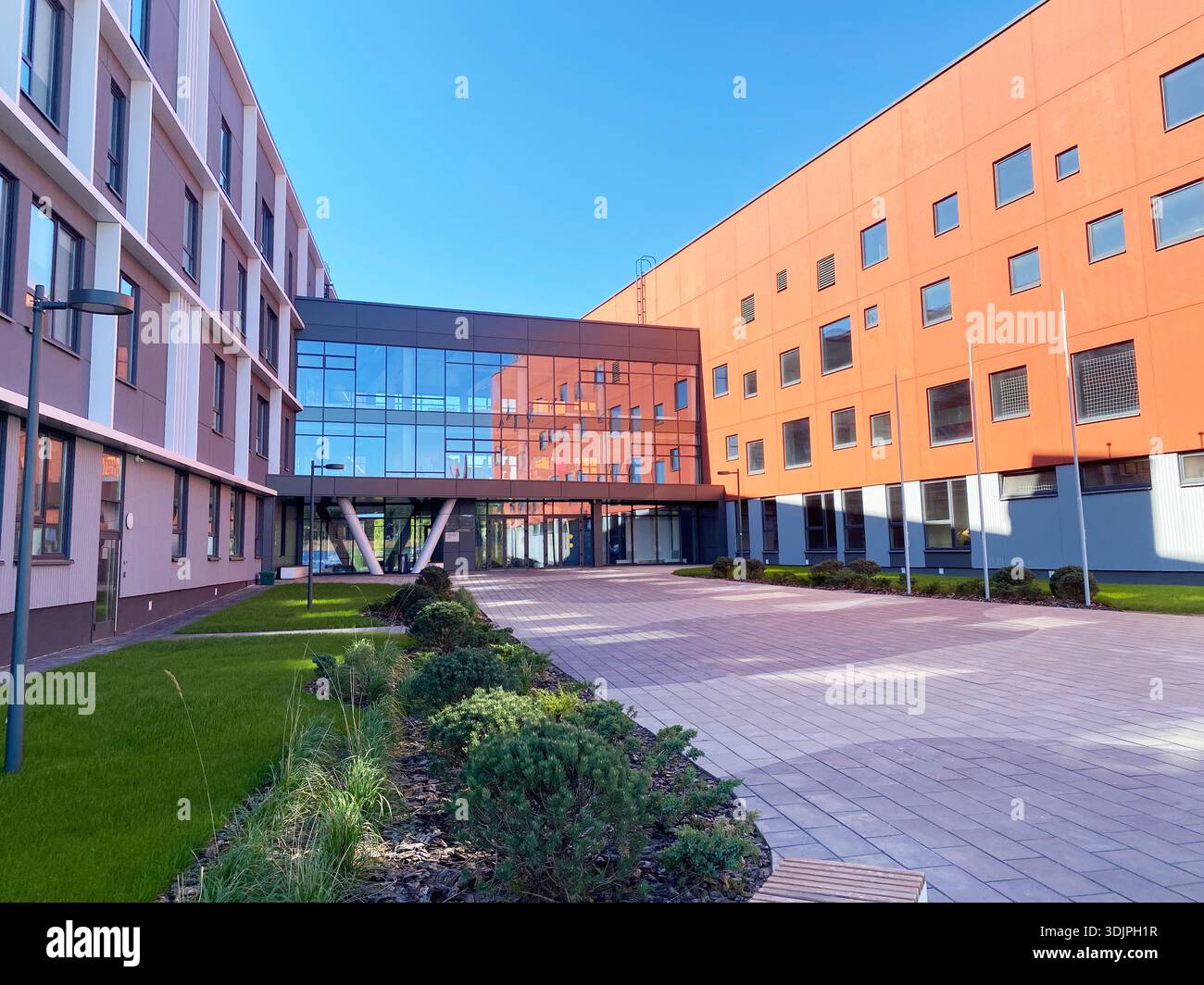 Modern school building features a large glass entrance and colorful ...