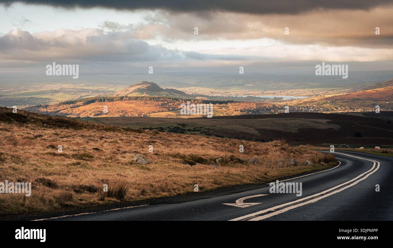 View north on Llangynidr Road at golden hour with road and road markings Stock Photo