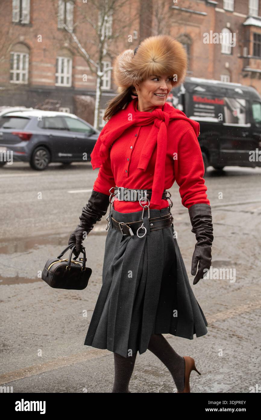 Janka Polliani arriving at Copenhagen Fashionweek Opéra Sport Fashionshow wearing a grey skirt, red pullover and an uschanka. Stock Photo