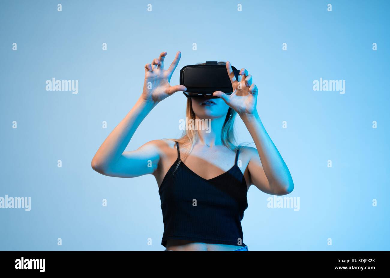 Virtual reality experience with woman using VR headset, interactive technology and metaverse concept Stock Photo
