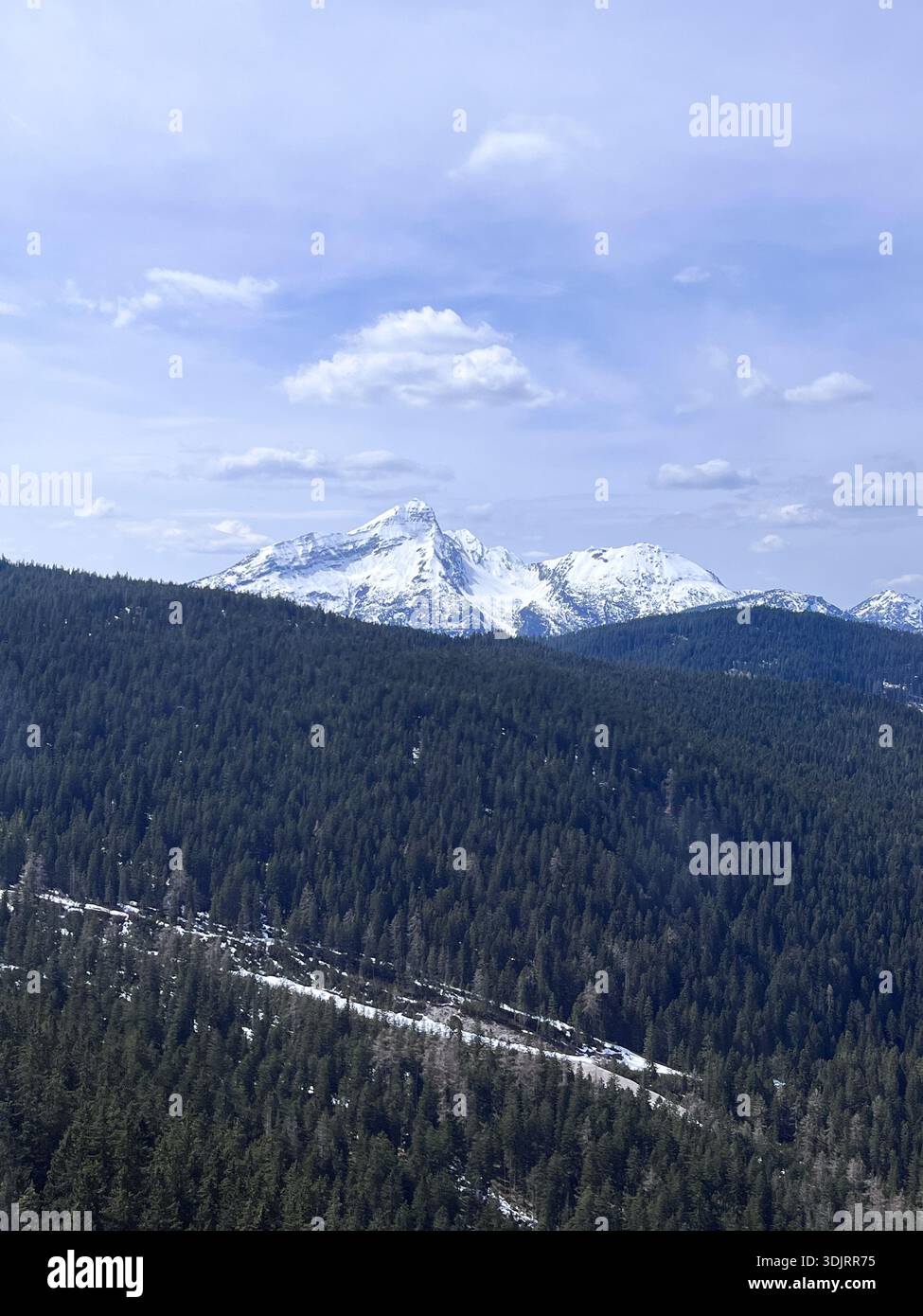 Going up to Zugspitze, the highest mountain of Germany near Garmisch Partenkirchen. Snow landscape in April. Winter in the Bavarian Alps. Hiking. - Smartphone Captured Stock Image