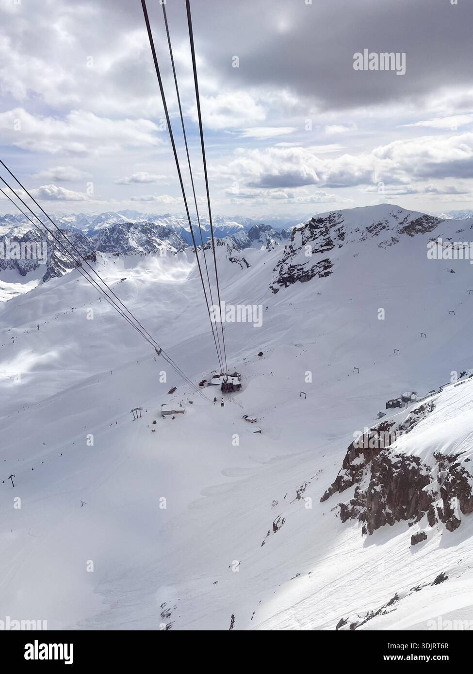 Zugspitze peak, the highest peak of Germany near Garmisch Partenkirchen. Snow landscape in April. Zugspitze Ski Resort. Winter in the Bavarian Alps. - Smartphone Captured Stock Image
