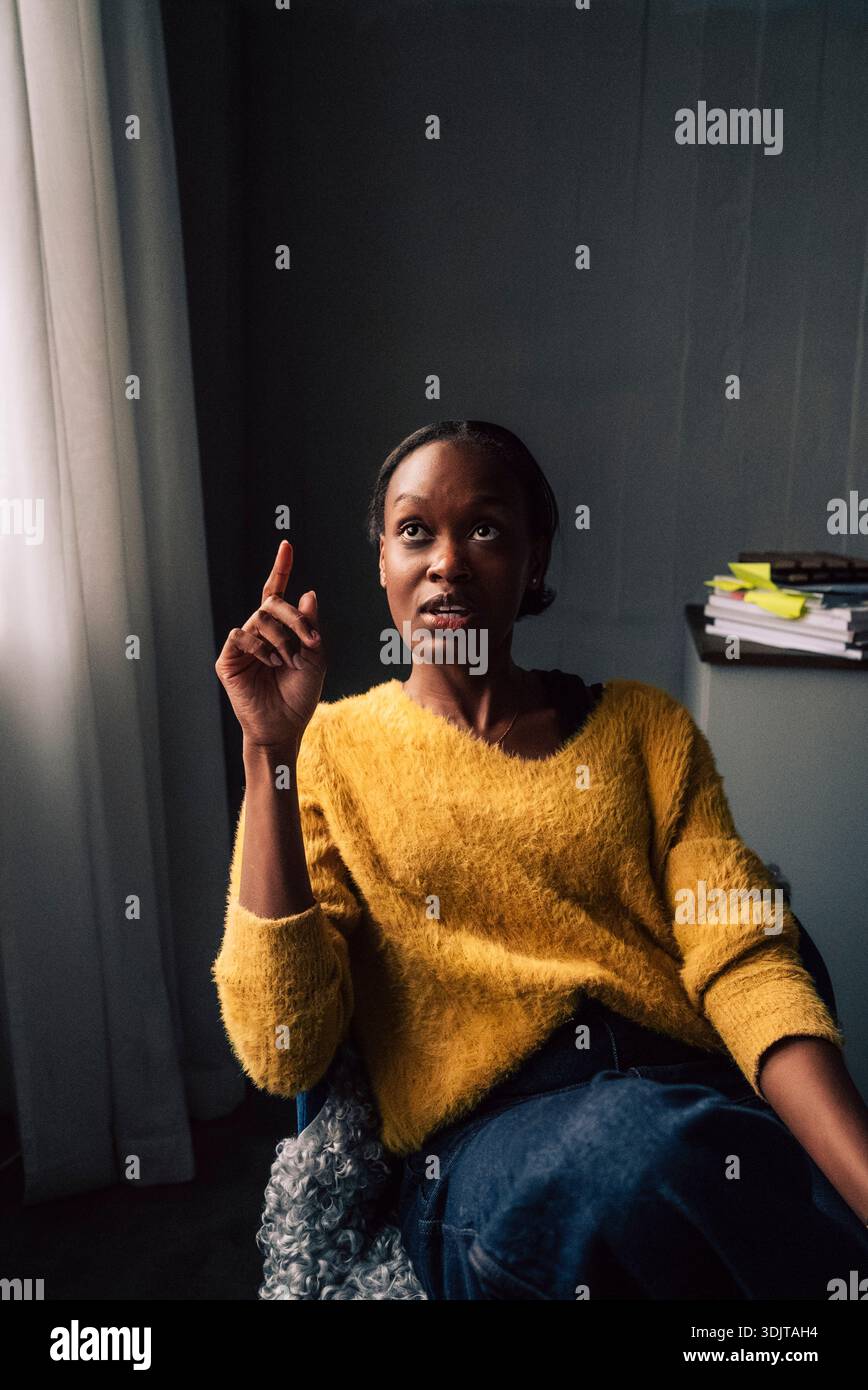 Female tech professional discussing while working in office Stock Photo