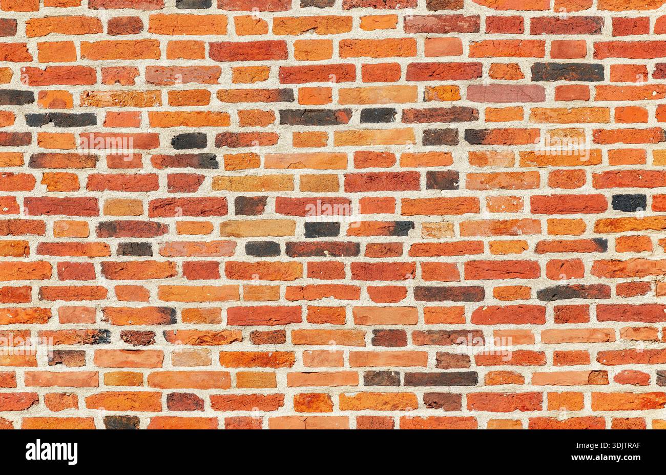 Weathered red brick wall as creative background texture Stock Photo