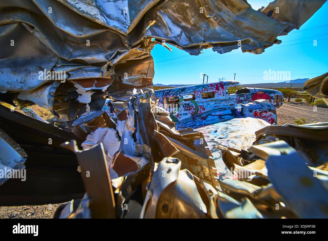 Graffiti Covered Abandoned Airplane Wreckage in Desert Near Beatty Nevada Stock Photo