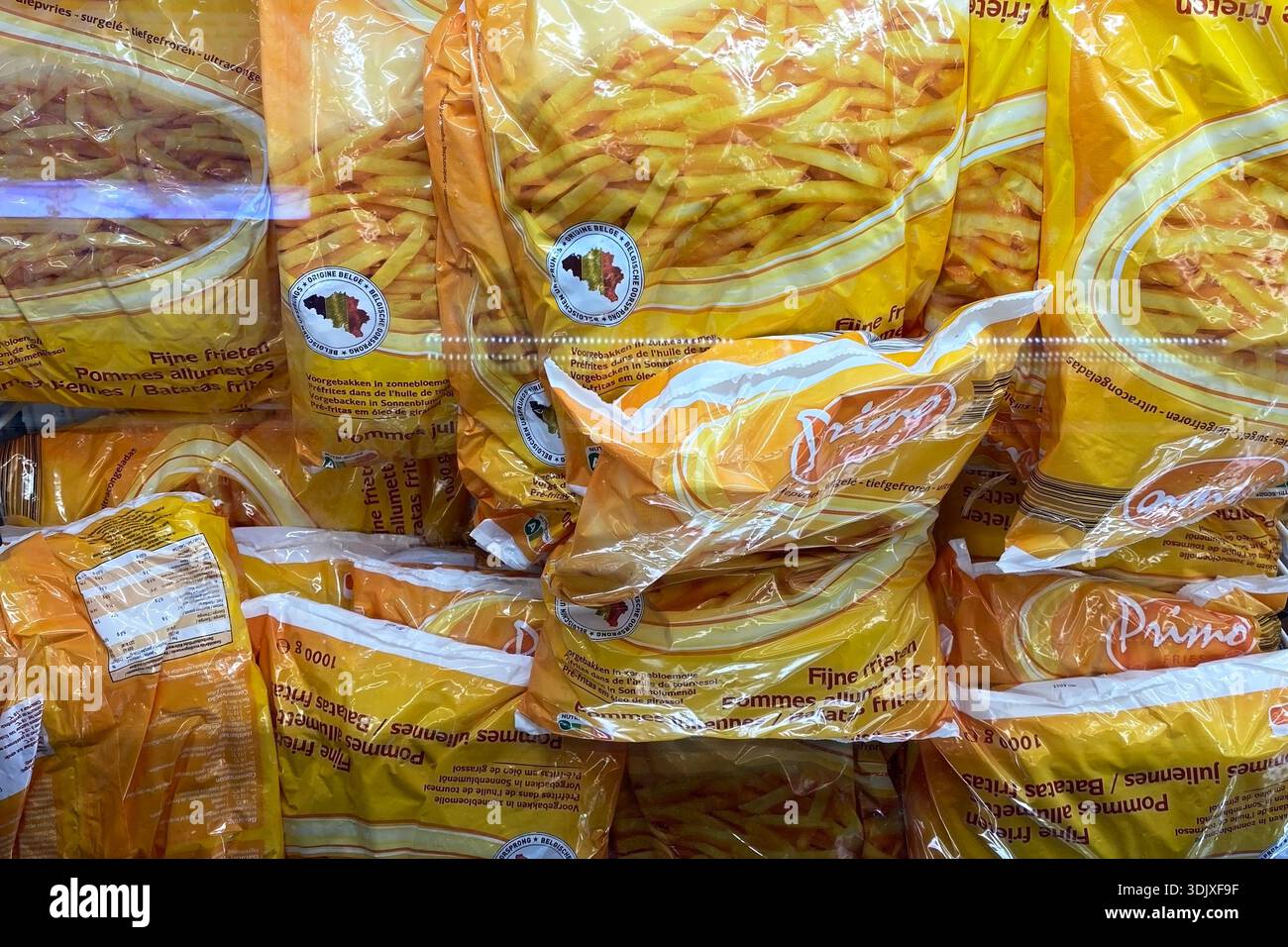 Stacked Bags of Golden Frozen French Fries in a Retail Freezer Stock ...
