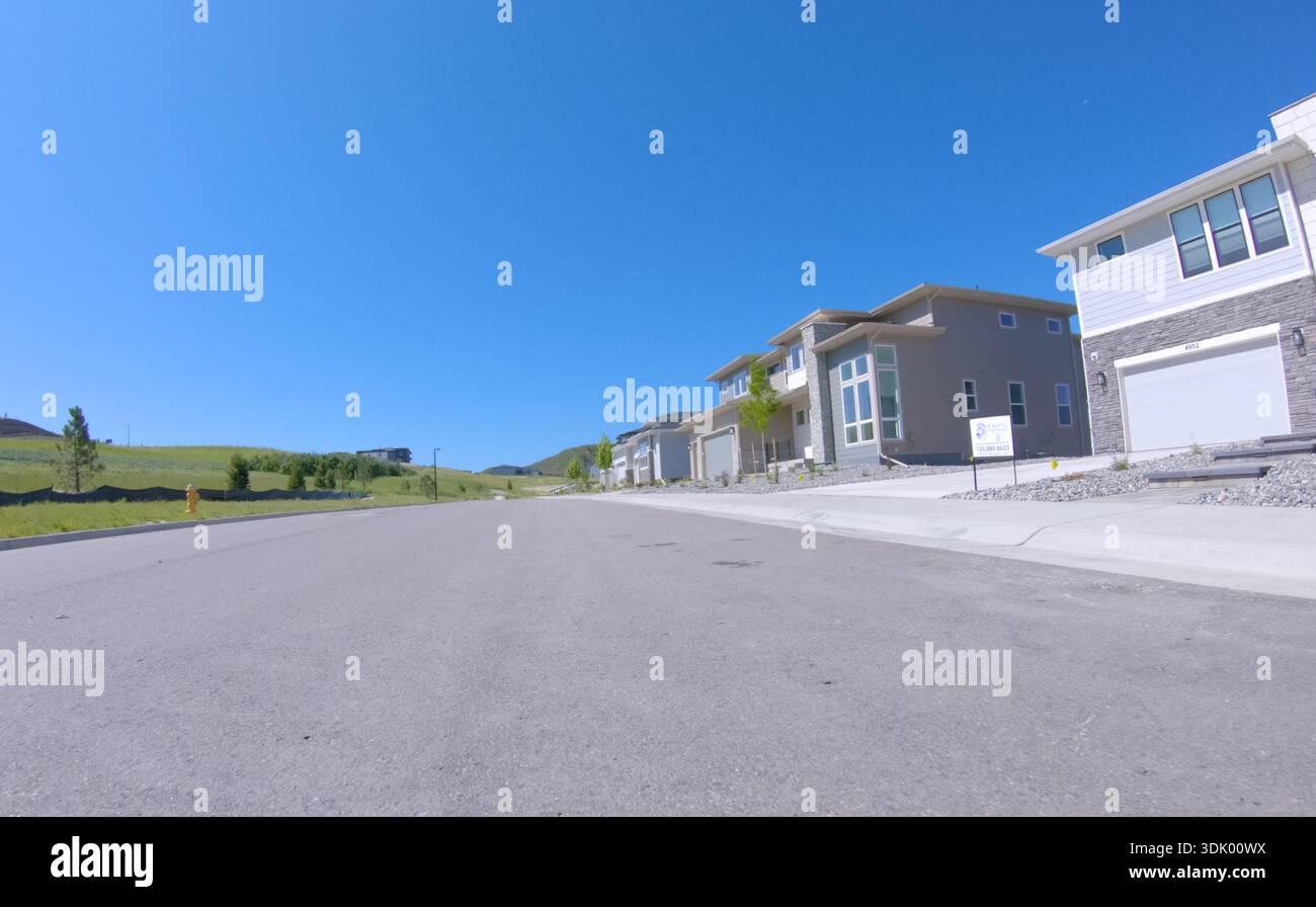 New home construction along clean driveway Stock Photo