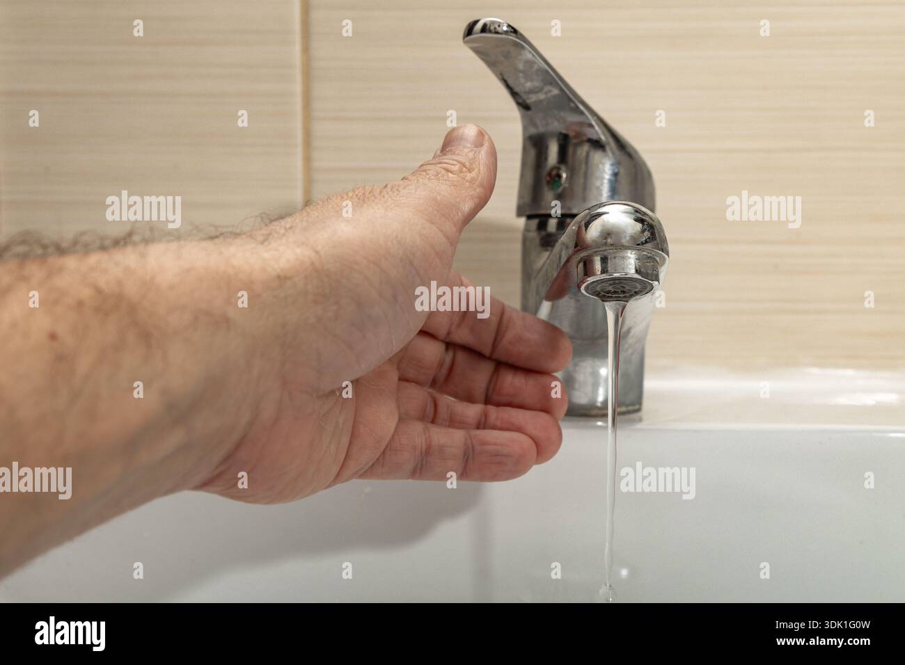 Water leaking from the tap into the sink, dripping clean water, data ...
