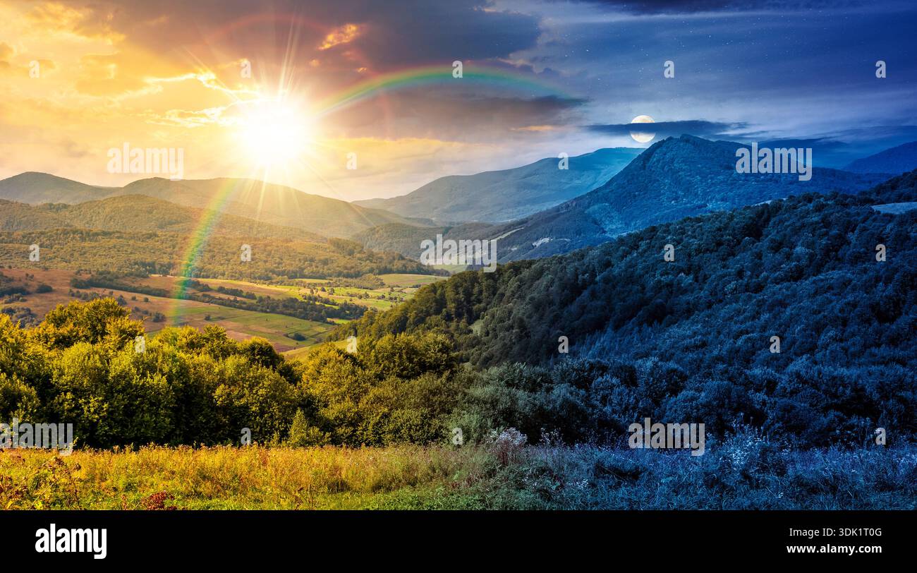 mountainous countryside scenery surrounded with forested rolling hills. day and night time change concept. rural area peaceful landscape with cloudy s Stock Photo