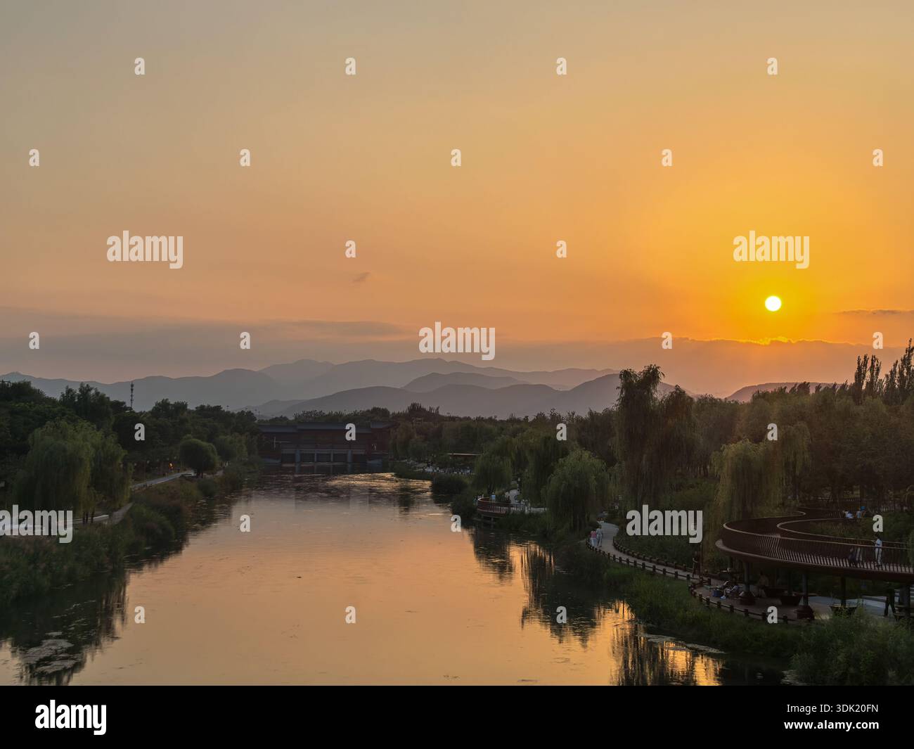 Sunset Reflection Over the Calm Qinghe River - Smartphone Captured Stock Image