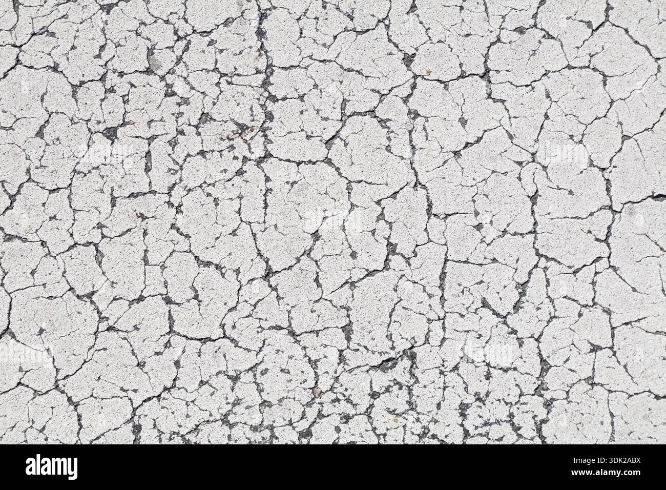 White cracked paint distressed background. Grunge peeling paint texture. Stock Photo
