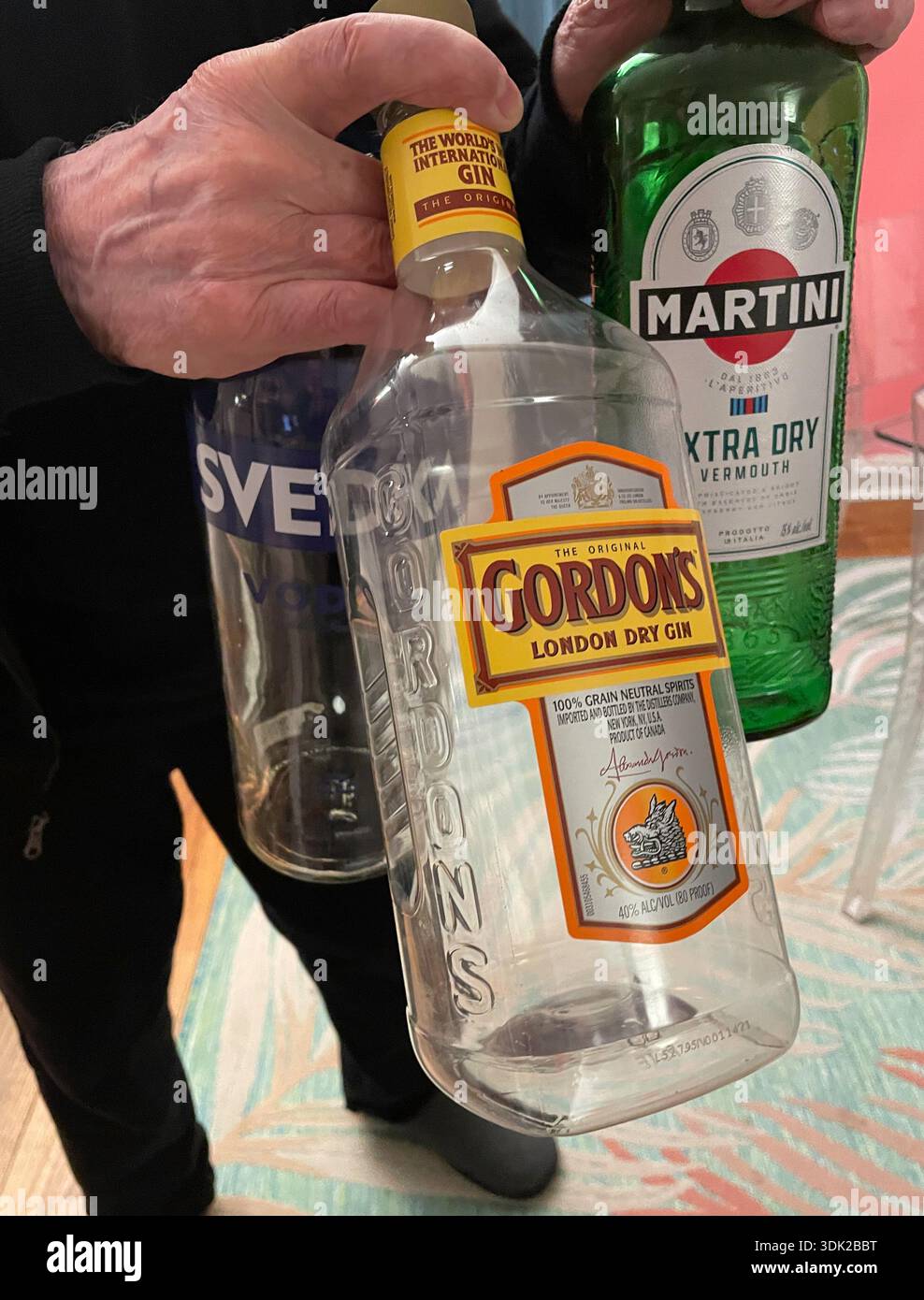 Close-up of empty liquor bottles after a party in a residential home, 2026, United States - Smartphone Captured Stock Image