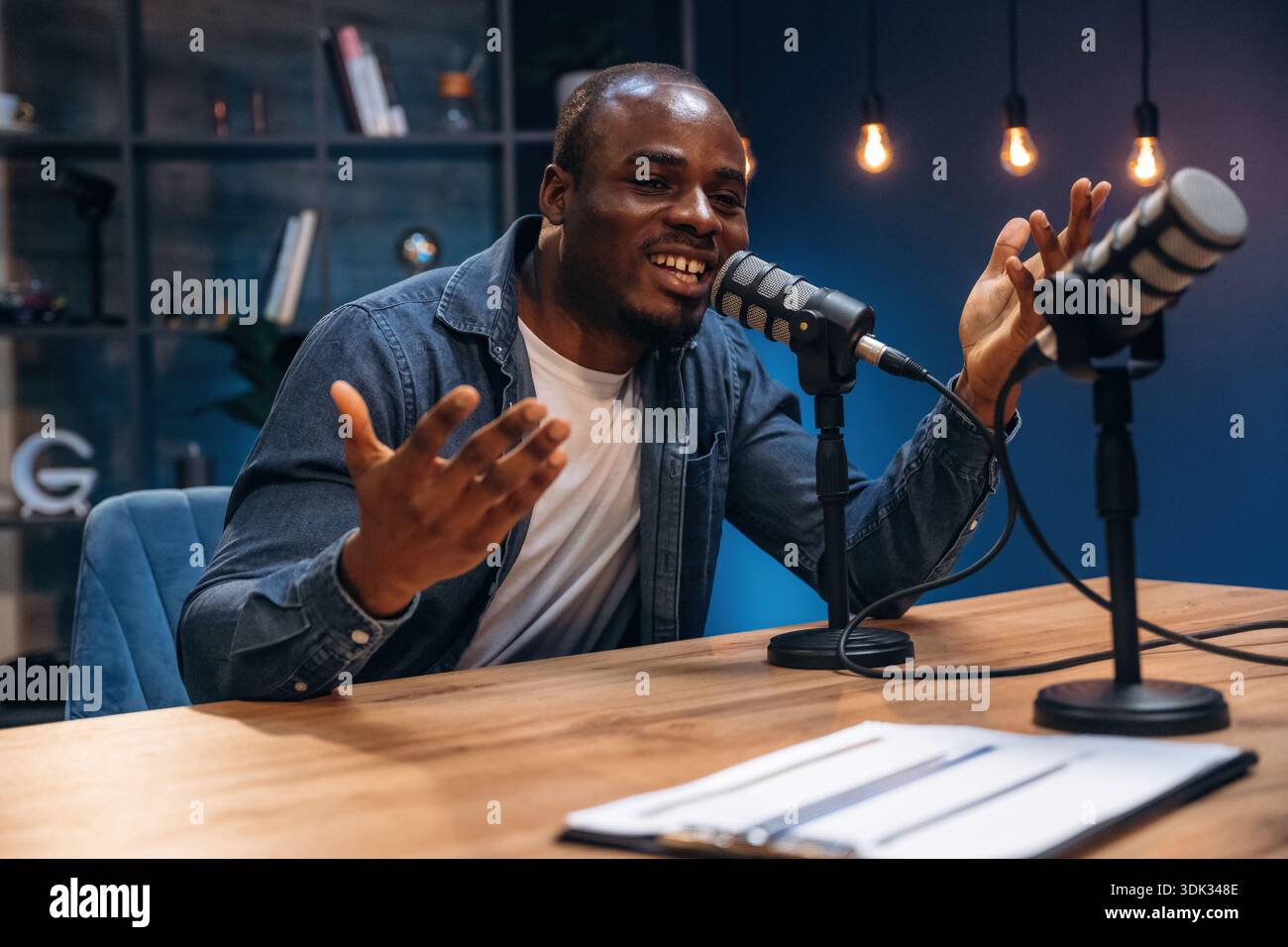 Black man is doing podcast in the studio. Stock Photo